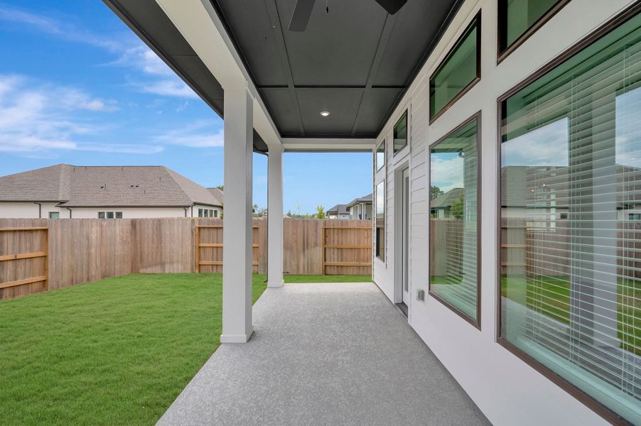 Exterior details and patio area of a home in ARTAVIA - Enclave Collection, Conroe (Image 4).