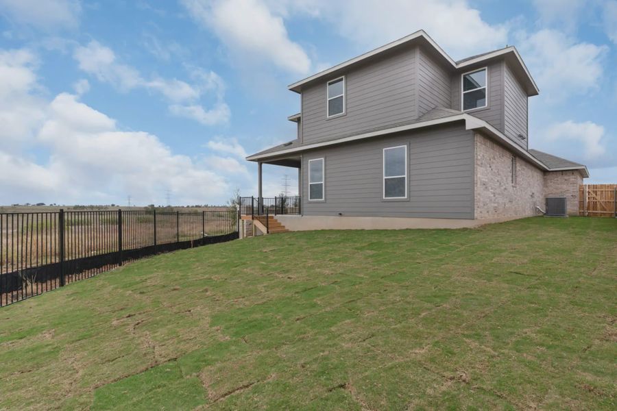 Exterior details and patio area of a home in The Grove at Blackhawk, Pflugerville (Image 3).