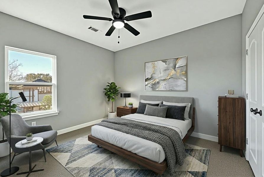 This cozy bedroom features a modern design with gray walls and a ceiling fan. It has a large window for natural light, stages a bed, stylish furniture, and tasteful decor, creating a welcoming and serene atmosphere.
