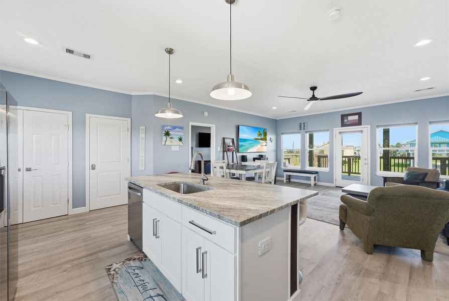 Spacious open-concept living area with modern kitchen, abundant natural light, and large windows offering scenic views. Spacious open-concept living area with modern kitchen, abundant natural light, and large windows offering scenic views.