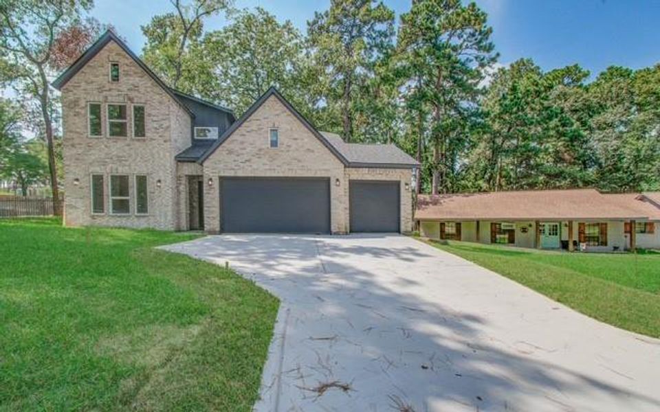 Front exterior of a new home in , Huntsville, TX, highlighting curb appeal (Image 24).
