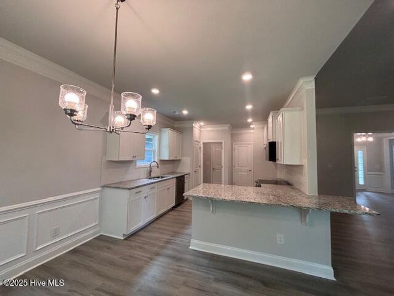 Furnished interior view inside a new home in River Village Square in River Landing, Wallace (Image 6).