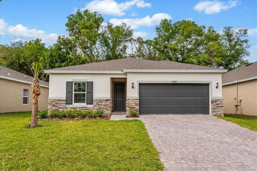 Front exterior of a new home in Willowbrook North, Winter Haven, FL, highlighting curb appeal (Image 1). Front exterior of a new home in Willowbrook North, Winter Haven, FL, highlighting curb appeal (Image 1).