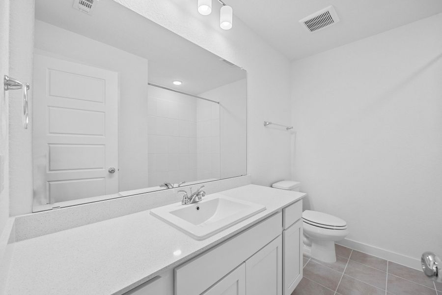 Bathroom in the Oak home plan by Trophy Signature Homes – REPRESENTATIVE PHOTO Bathroom in the Oak home plan by Trophy Signature Homes – REPRESENTATIVE PHOTO