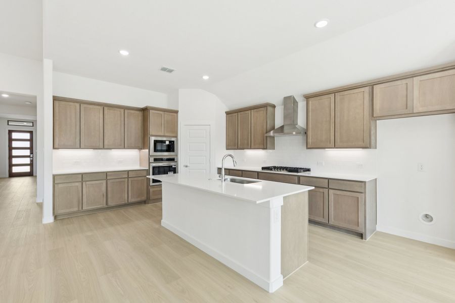 Kitchen in the Gilmour II home plan by Trophy Signature Homes – REPRESENTATIVE PHOTO