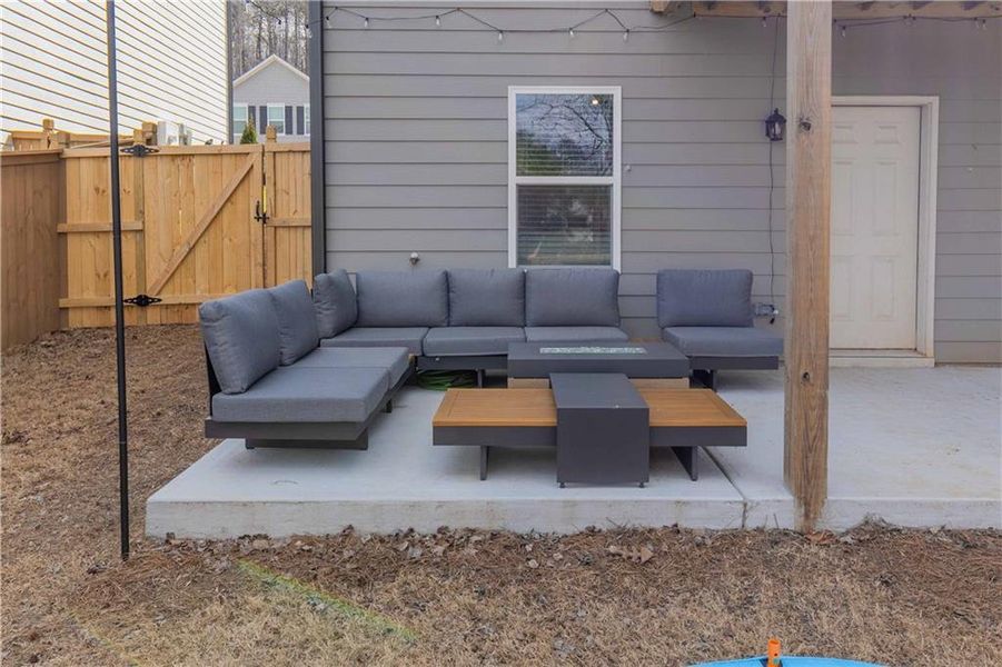 Exterior details and patio area of a home in Creekside at Farmers Crossing, Ball Ground (Image 29).