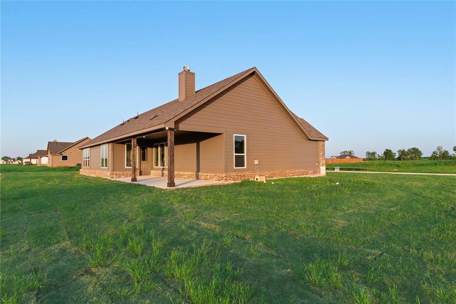 Front exterior of a new home in Oak Valley, Oak Ridge, TX, highlighting curb appeal (Image 27).
