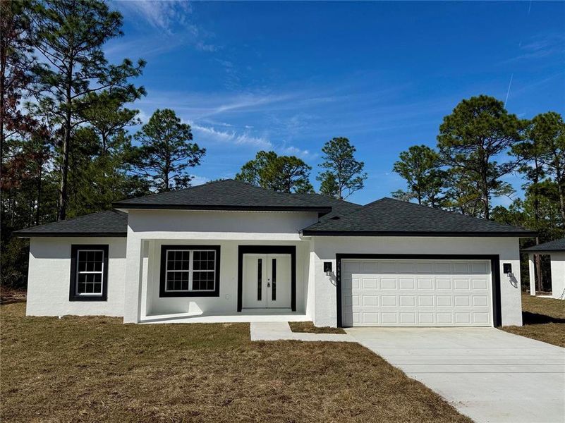 Front exterior of a new home in , Citrus Springs, FL, highlighting curb appeal (Image 11). Front exterior of a new home in , Citrus Springs, FL, highlighting curb appeal (Image 11).