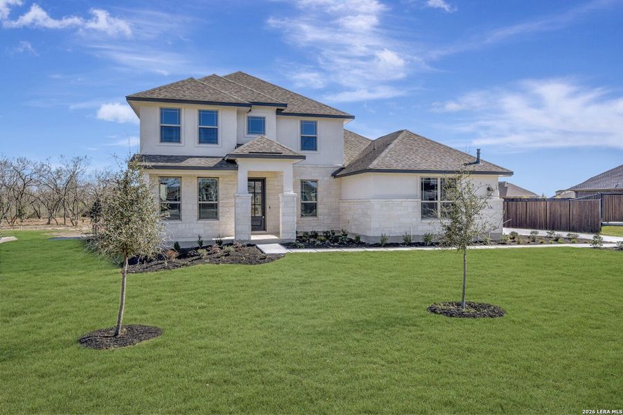 Front exterior of a new home in Everly Estates, San Antonio, TX, highlighting curb appeal (Image 21).