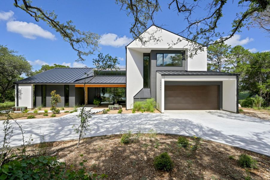 Front exterior of a new home in , Jonestown, TX, highlighting curb appeal (Image 24). Front exterior of a new home in , Jonestown, TX, highlighting curb appeal (Image 24).