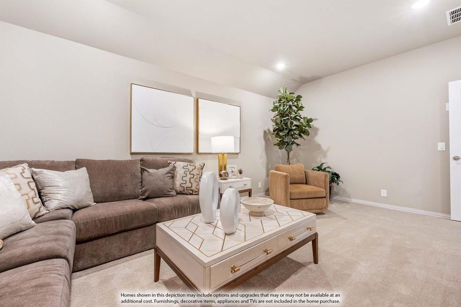 Living room with gray sofa, geometric coffee table, accent chair, and neutral carpet flooring Living room with gray sofa, geometric coffee table, accent chair, and neutral carpet flooring
