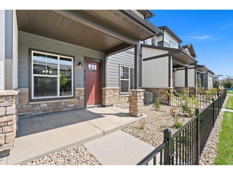 Exterior details and patio area of a home in The Lakes at Centerra, Loveland (Image 17).