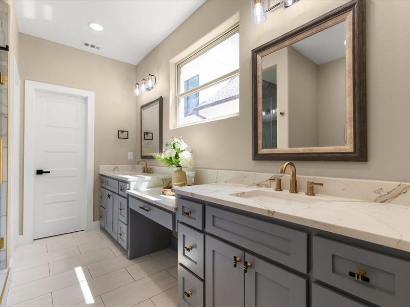 Bathroom with double vanity and recessed lighting