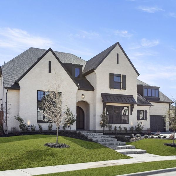 Front exterior of a new home in Mustang Lakes, Celina, TX, highlighting curb appeal (Image 31). Front exterior of a new home in Mustang Lakes, Celina, TX, highlighting curb appeal (Image 31).