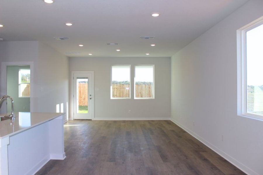 A bathroom with a wood floor.