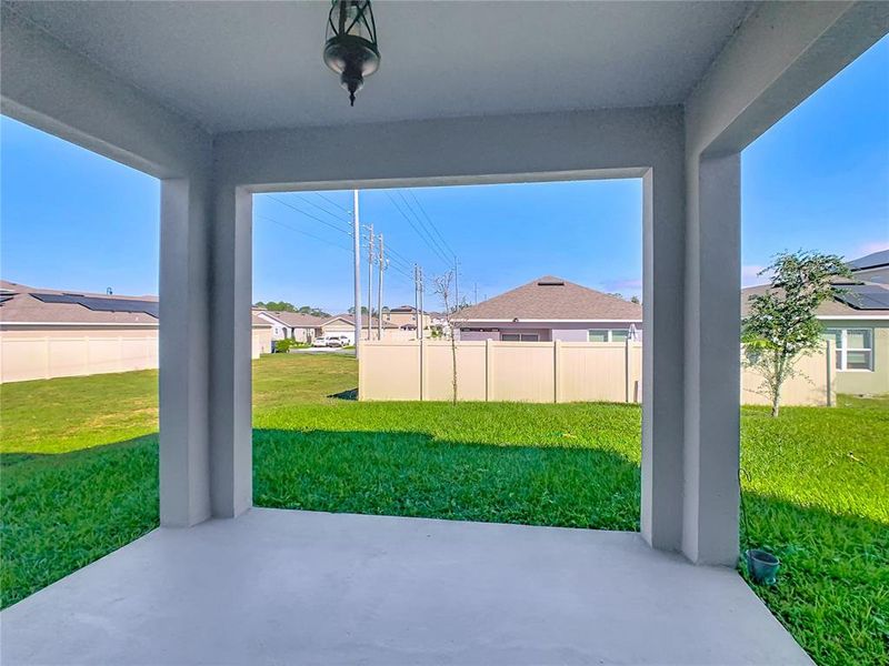 Exterior details and patio area of a home in Horse Creek at Crosswinds, Davenport (Image 25).