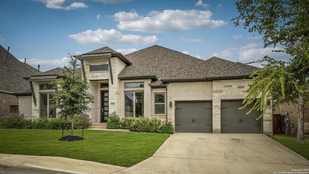 Front exterior of a new home in Balcones Creek 70', Boerne, TX, highlighting curb appeal (Image 22).