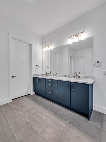 Bathroom featuring vanity and tile patterned floors