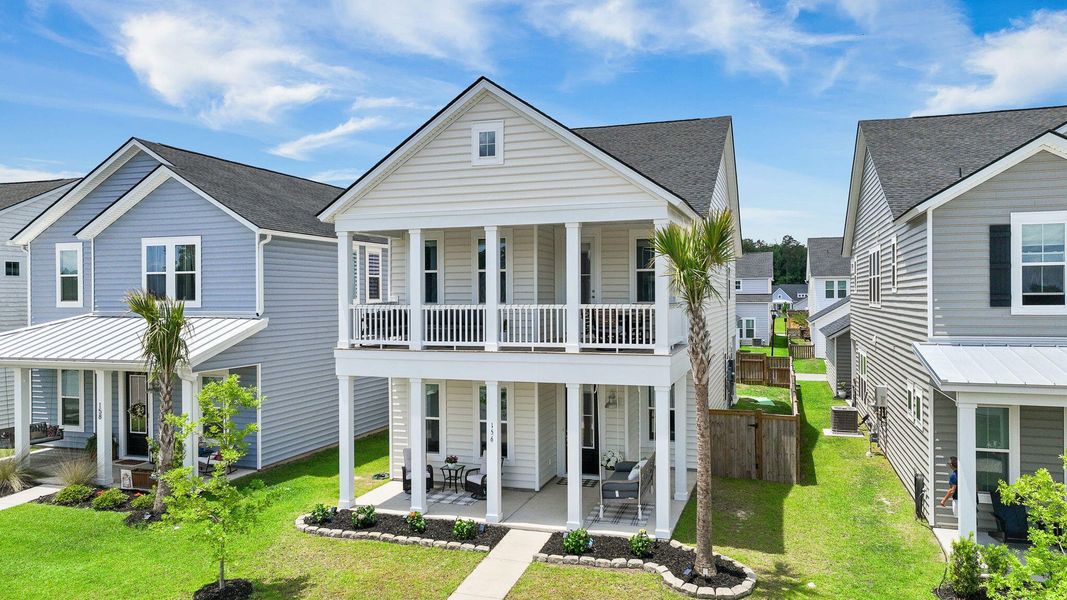 Front exterior of a new home in Heron's Walk at Summers Corner, Summerville, SC, highlighting curb appeal (Image 28). Front exterior of a new home in Heron's Walk at Summers Corner, Summerville, SC, highlighting curb appeal (Image 28).