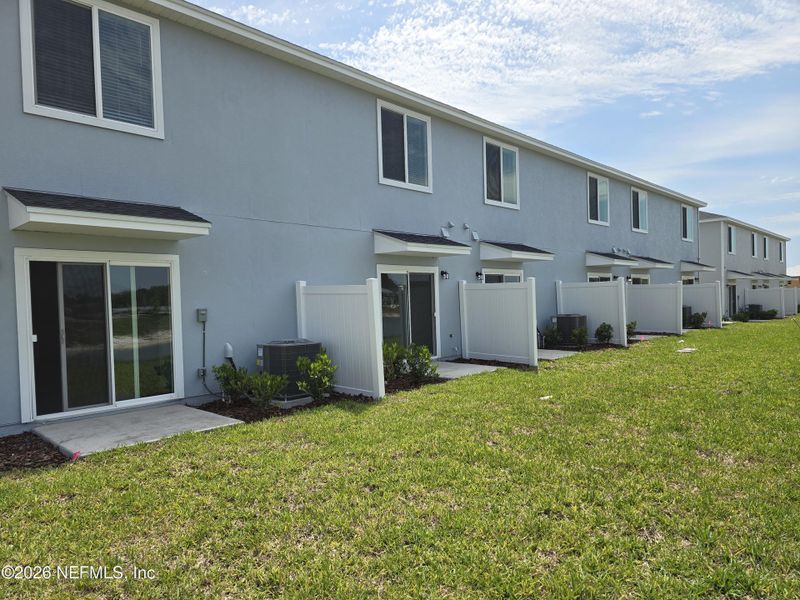 Exterior details and patio area of a home in The District at Oakleaf - The Commons, Middleburg (Image 4).