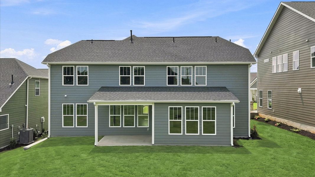 Rear covered porch offers a private, first-rate setting for outdoor enjoyment