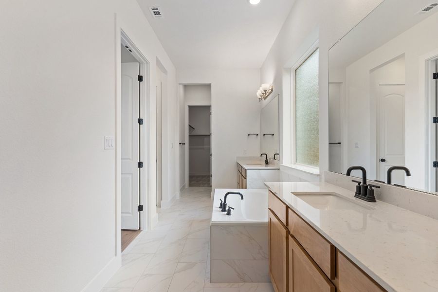 Representative furnished interior of a home built from the Waterville by Ashton Woods in The Trails at Carmel, Pflugerville (Image 11).
