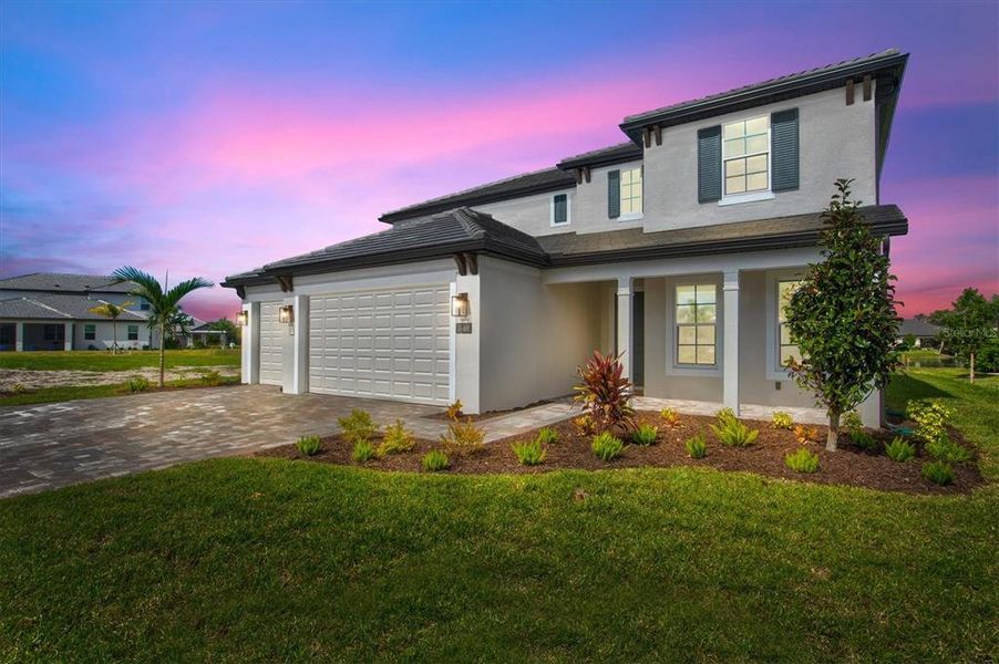 Front exterior of a new home in Cassata Lakes, Nokomis, FL, highlighting curb appeal (Image 1). Front exterior of a new home in Cassata Lakes, Nokomis, FL, highlighting curb appeal (Image 1).