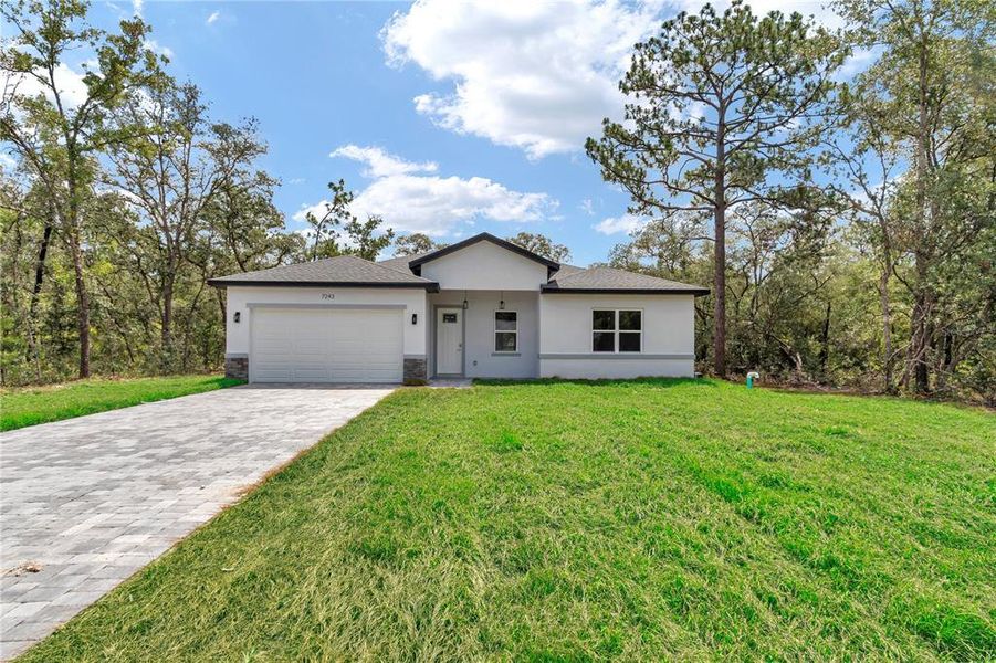 Front exterior of a new home in , Citrus Springs, FL, highlighting curb appeal (Image 21).