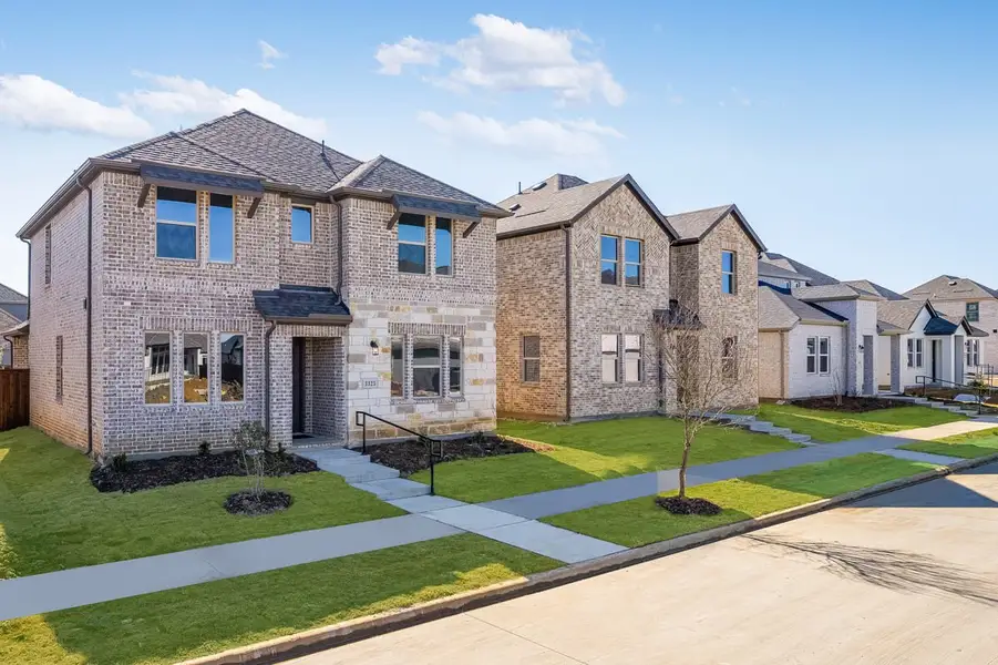 Front exterior of a new home in North Sky Celina, Celina, TX, highlighting curb appeal (Image 2). Front exterior of a new home in North Sky Celina, Celina, TX, highlighting curb appeal (Image 2).