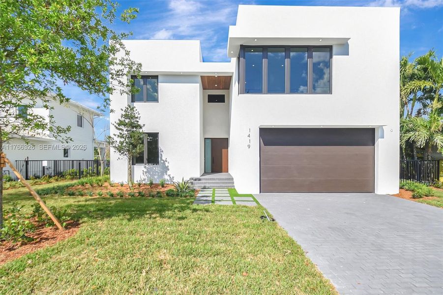 Front exterior of a new home in , Lake Worth, FL, highlighting curb appeal (Image 23).