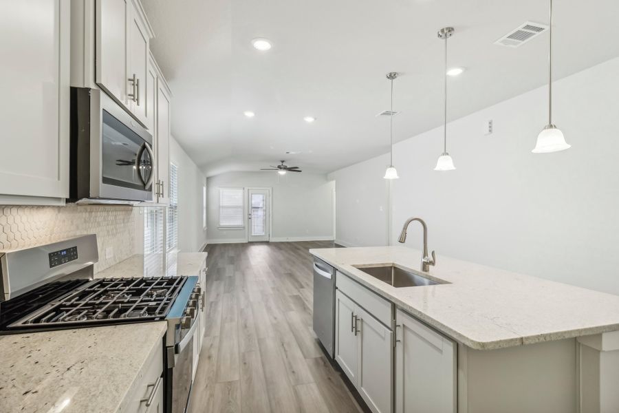 Kitchen in the Hughes floorplan at a Meritage Homes community.