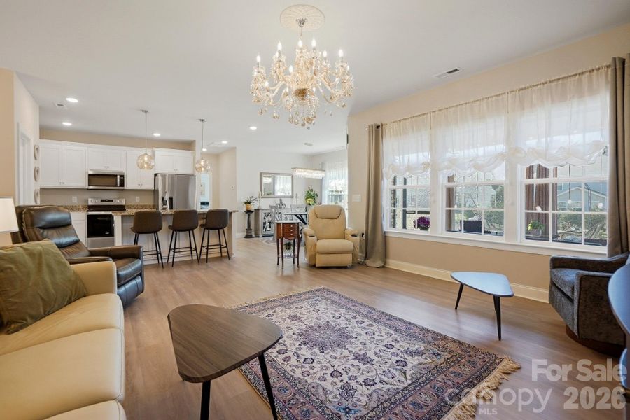 large living room open to the kitchen and dining room.