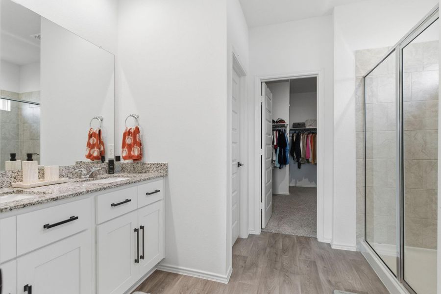 Luxurious ensuite with dual granite vanities, massive walk-in shower, and a large closet. Luxurious ensuite with dual granite vanities, massive walk-in shower, and a large closet.