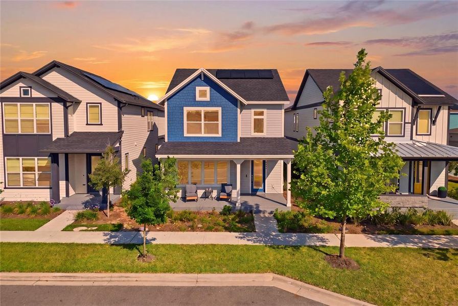 Front exterior of a new home in Weslyn Park in Sunbridge 34', St. Cloud, FL, highlighting curb appeal (Image 33).