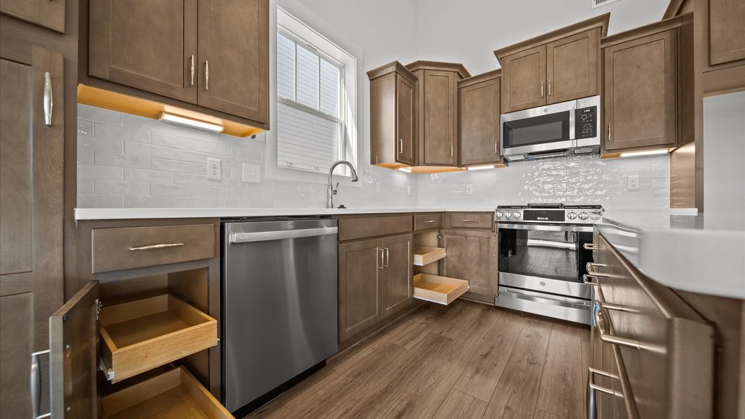 Accomplished kitchen layout with a compact island, perfect for prep and casual dining