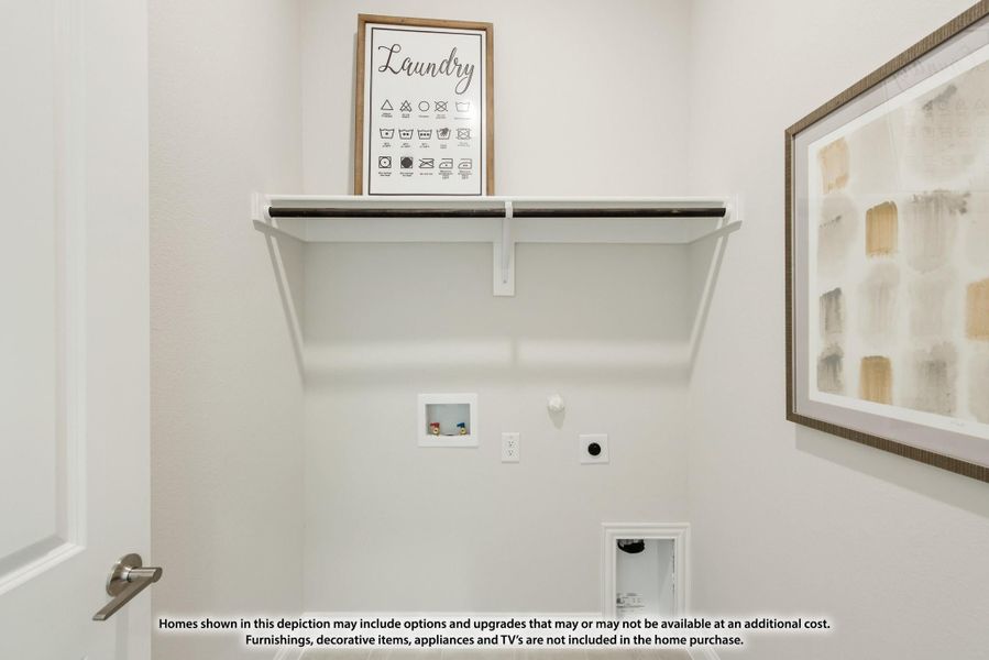 Laundry room with wall-mounted shelf, hanging rod, and washer and dryer hookups on white walls Laundry room with wall-mounted shelf, hanging rod, and washer and dryer hookups on white walls