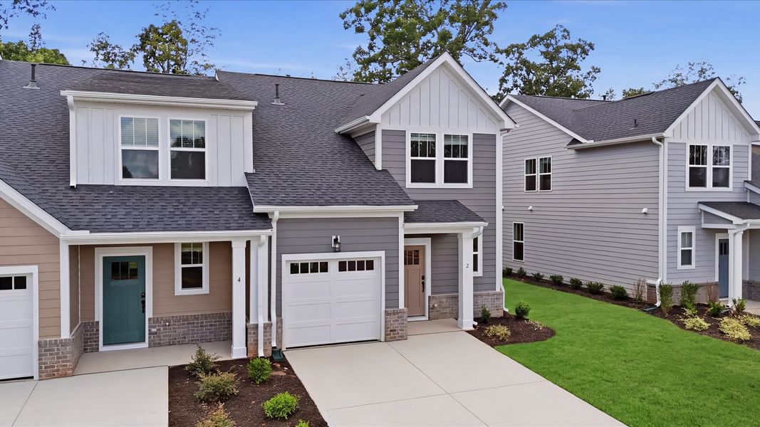 Front exterior of a new home in Pelham Crossing Villas, Greenville, SC, highlighting curb appeal (Image 2). Front exterior of a new home in Pelham Crossing Villas, Greenville, SC, highlighting curb appeal (Image 2).