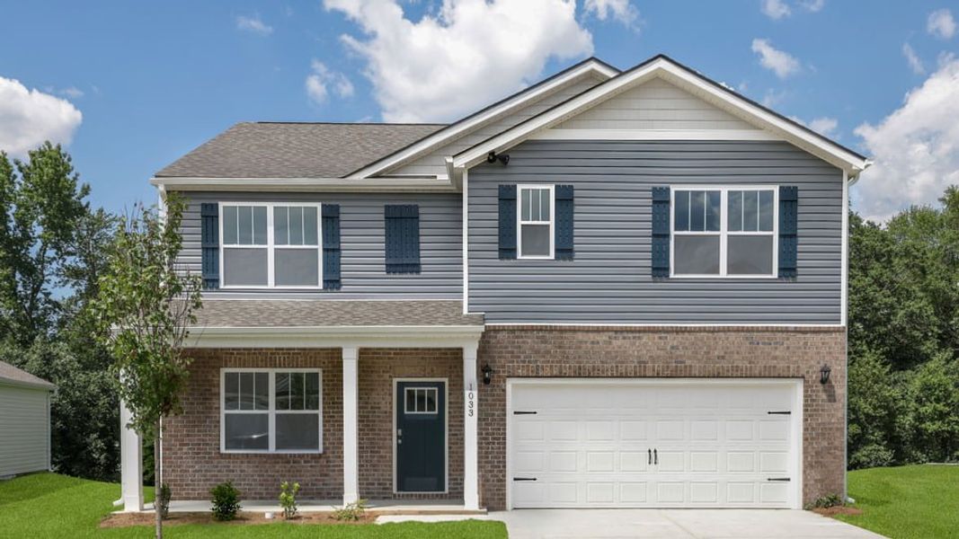 Front exterior of a new home in Woodglen, Piedmont, SC, highlighting curb appeal (Image 1). Front exterior of a new home in Woodglen, Piedmont, SC, highlighting curb appeal (Image 1).