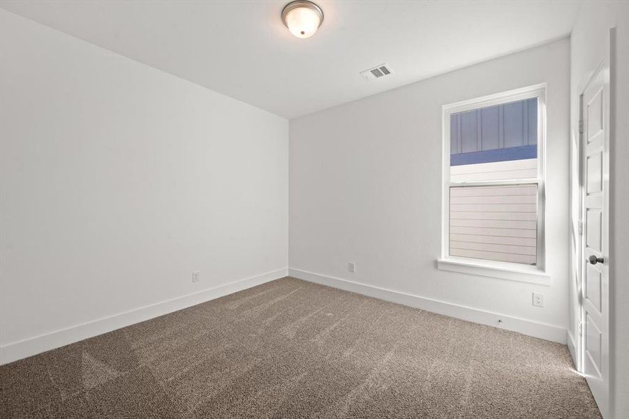 Second bedroom with carpet