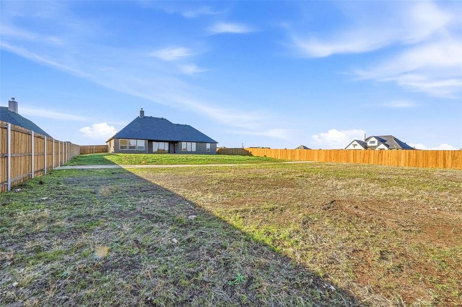 Exterior details and patio area of a home in Coyote Crossing, Godley (Image 4).