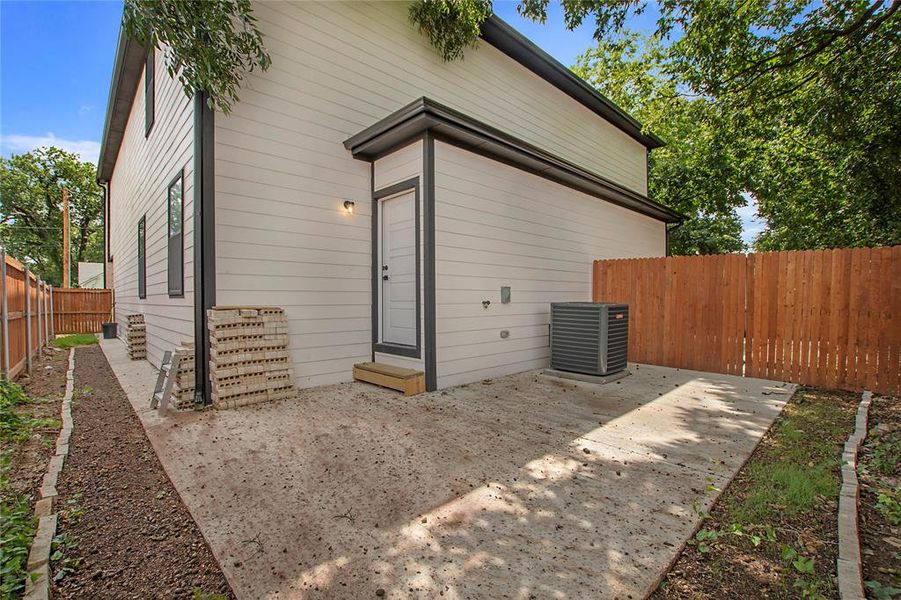 Rear view of house featuring a patio area and central air condition unit