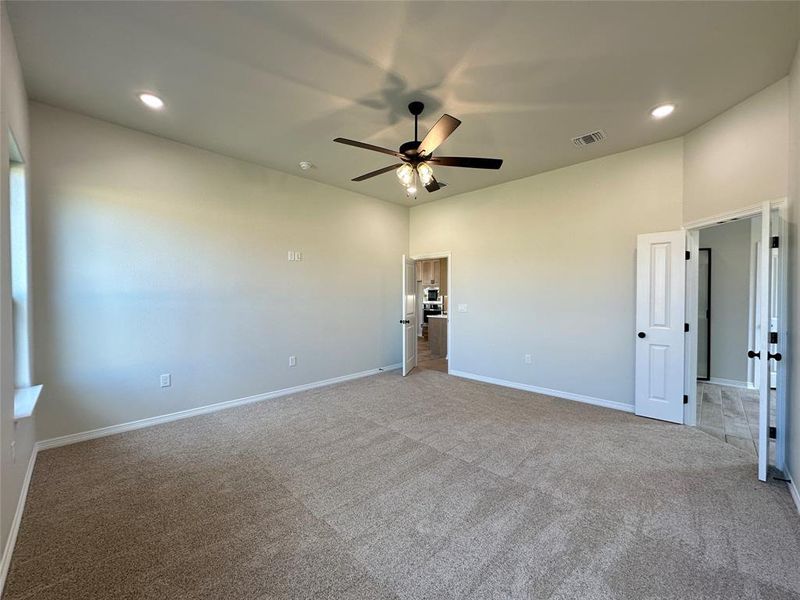 Spare room featuring recessed lighting, carpet floors, and a ceiling fan