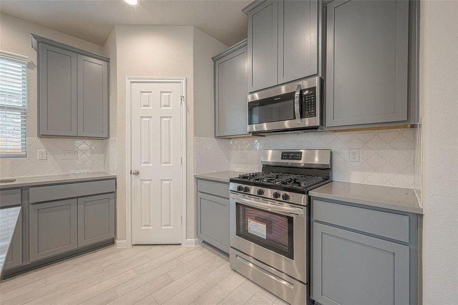 Furnished interior view inside a new home in Sunterra, Katy (Image 8).