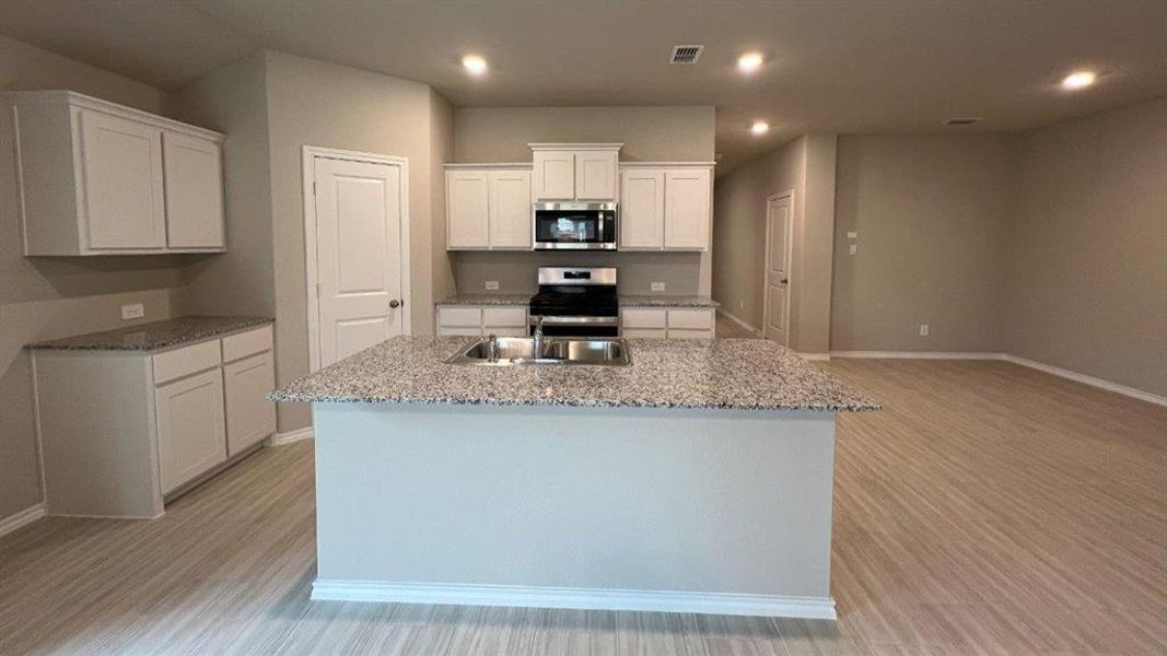 Kitchen- All Home and community information, including pricing, included features, terms, availability and amenities, are subject to change at any time without notice or obligation. All Drawings, pictures, photographs, video, square footages, floor plans, elevations, features, colors and sizes are approximate for illustration purposes only and will vary from the homes as built.