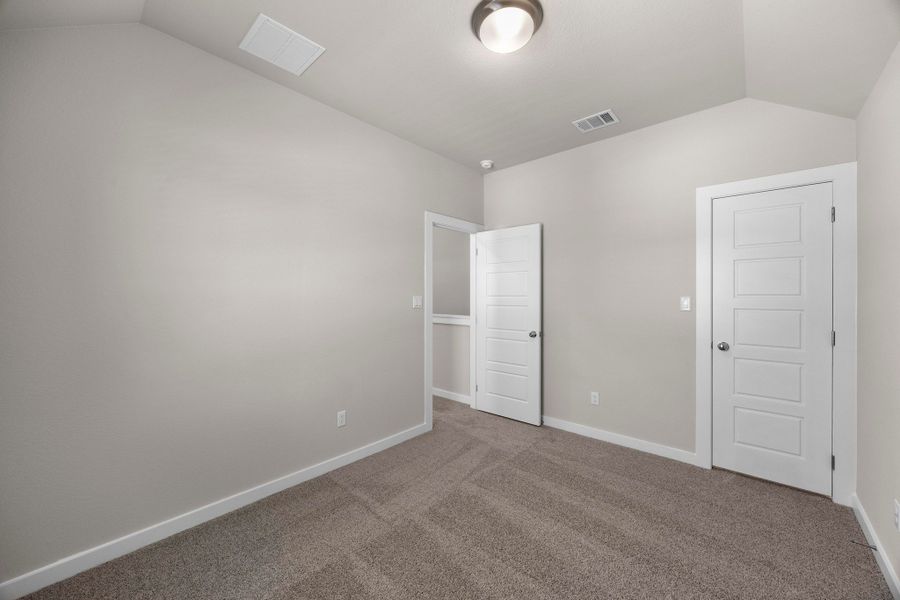 Bedroom in the Magnolia home plan by Trophy Signature Homes – REPRESENTATIVE PHOTO Bedroom in the Magnolia home plan by Trophy Signature Homes – REPRESENTATIVE PHOTO