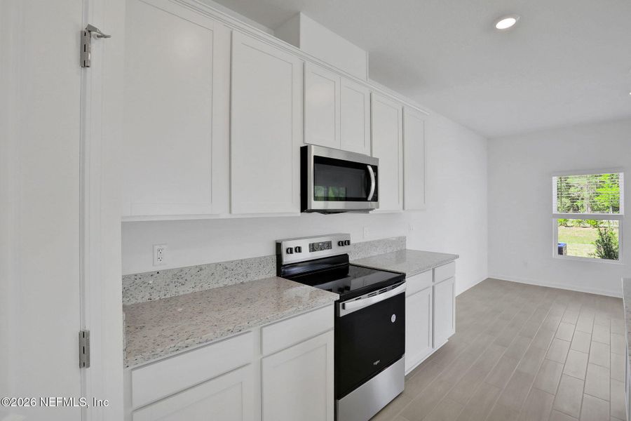 Furnished interior view inside a new home in Amberly, Green Cove Springs (Image 13).