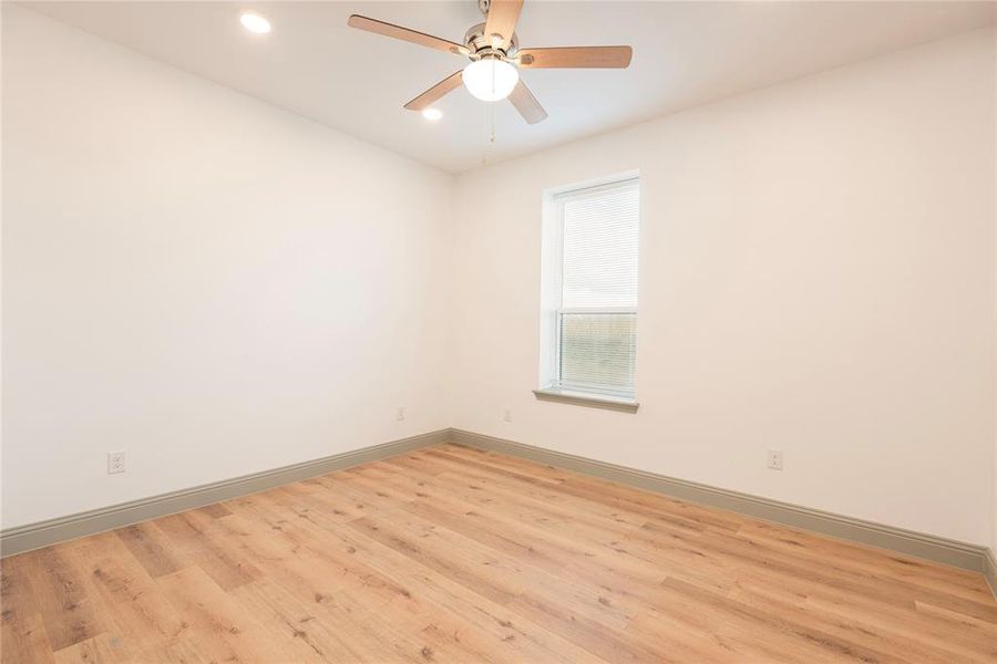 Spare room featuring light wood-style floors, recessed lighting, and a ceiling fan