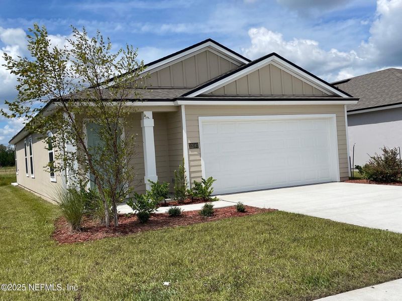 Front exterior of a new home in The Arbors, Jacksonville, FL, highlighting curb appeal (Image 16).