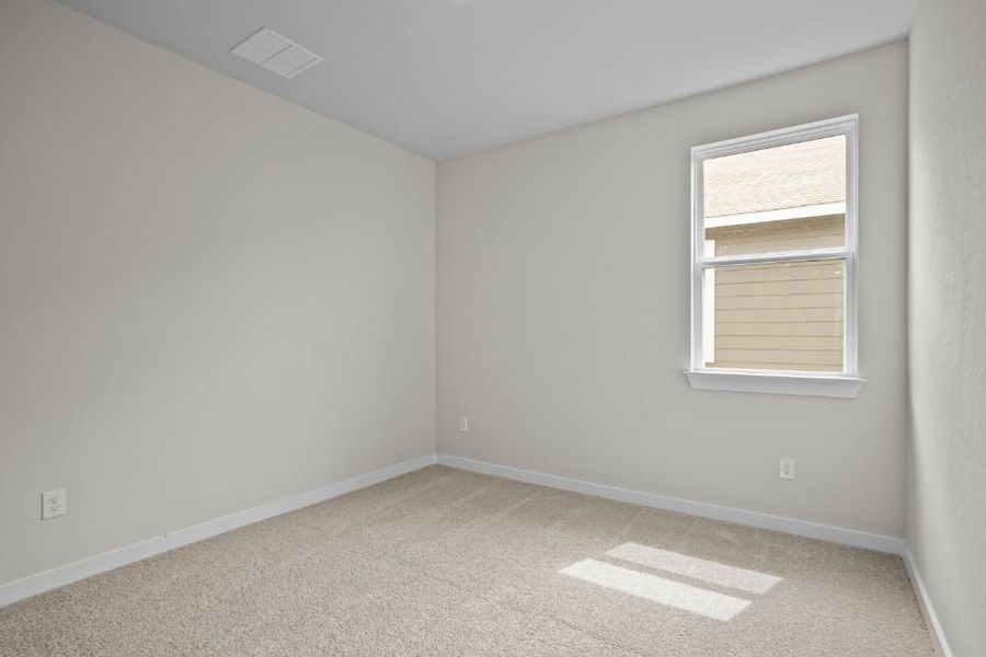 A room with a window and carpet. A room with a window and carpet.