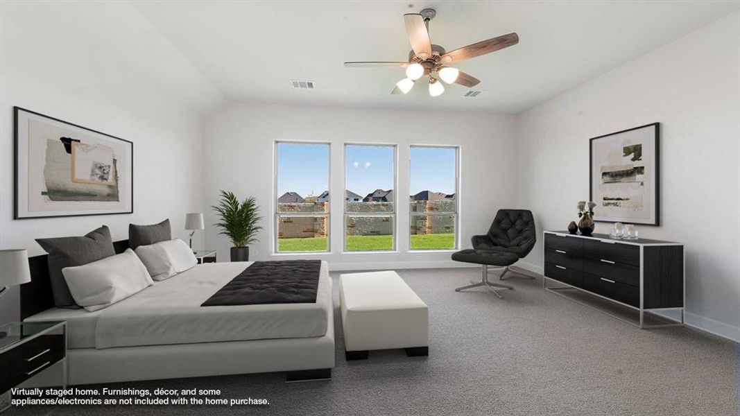 Bedroom with ceiling fan, carpet, and vaulted ceiling